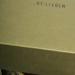 Stilleben Cestino con sfumature arancioni